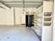 Spacious garage with an abundance of shelving for organized storage solutions at 2053 E Clubhouse Dr, Phoenix, AZ 85048