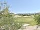 Picturesque view of a golf course with rolling hills and mountain backdrop at 2053 E Clubhouse Dr, Phoenix, AZ 85048
