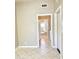 Neutral-colored hallway with tile floor and doorways leading to various rooms in the home at 2053 E Clubhouse Dr, Phoenix, AZ 85048