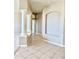 Bright foyer with decorative columns and tile floors at 2053 E Clubhouse Dr, Phoenix, AZ 85048