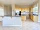 Bright and open kitchen area with stainless steel appliances, granite countertops, and breakfast bar at 2053 E Clubhouse Dr, Phoenix, AZ 85048