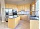 Spacious kitchen with stainless steel appliances, granite countertops, and ample cabinet space at 2053 E Clubhouse Dr, Phoenix, AZ 85048