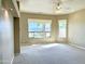 Carpeted living room provides natural light and community views through large windows at 2053 E Clubhouse Dr, Phoenix, AZ 85048