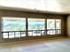 Bright living room with large windows offering stunning mountain views and backyard pool access at 2053 E Clubhouse Dr, Phoenix, AZ 85048