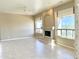 Bright and airy living room with a fireplace, large windows, and tile flooring at 2053 E Clubhouse Dr, Phoenix, AZ 85048
