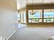 Open living room with large windows providing panoramic views, carpet flooring and modern lighting at 2053 E Clubhouse Dr, Phoenix, AZ 85048