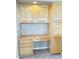 Built-in office space with cabinets, desk, and drawers provides a dedicated workspace in the home at 2053 E Clubhouse Dr, Phoenix, AZ 85048