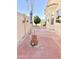 Back patio featuring desert landscaping, mature trees, and brick pavers at 2053 E Clubhouse Dr, Phoenix, AZ 85048