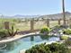 Beautiful backyard pool with scenic mountain views and lush landscaping at 2053 E Clubhouse Dr, Phoenix, AZ 85048