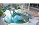 Inviting backyard pool with lush greenery and serene umbrella, offers a tranquil retreat for relaxation and enjoyment at 2053 E Clubhouse Dr, Phoenix, AZ 85048