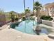 Private backyard pool featuring waterfall feature, stone accents, and plenty of space to relax at 2053 E Clubhouse Dr, Phoenix, AZ 85048