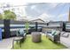 Backyard with stylish seating, firepit, and lush landscaping for outdoor enjoyment at 2109 W Berridge Ln, Phoenix, AZ 85015