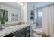 Bathroom featuring a granite vanity top, new fixtures, and a shower/tub combination at 2109 W Berridge Ln, Phoenix, AZ 85015
