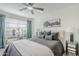 Inviting bedroom featuring a ceiling fan and stylish decor at 2109 W Berridge Ln, Phoenix, AZ 85015