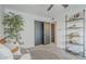 Bright bedroom with a ceiling fan, comfortable seating area, and a slider closet at 2109 W Berridge Ln, Phoenix, AZ 85015