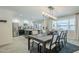 Modern dining area with an open view to the kitchen, with decor, and natural light at 2109 W Berridge Ln, Phoenix, AZ 85015