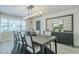 Elegant dining room features modern lighting and stylish furnishings, creating a welcoming atmosphere at 2109 W Berridge Ln, Phoenix, AZ 85015