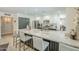 Bright modern kitchen with stainless steel appliances, granite countertops, and sleek white cabinetry at 2109 W Berridge Ln, Phoenix, AZ 85015