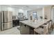 Modern kitchen features stainless steel appliances, spacious island, and bright white cabinets at 2109 W Berridge Ln, Phoenix, AZ 85015