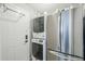 Laundry room including new stainless steel refrigerator and washer/dryer combo at 2109 W Berridge Ln, Phoenix, AZ 85015