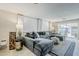 Cozy living room featuring a large sectional sofa and sliding glass doors for ample natural light at 2109 W Berridge Ln, Phoenix, AZ 85015