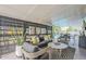 Covered patio with stylish seating area overlooking the pool and backyard at 2109 W Berridge Ln, Phoenix, AZ 85015