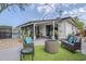 Cozy outdoor patio with comfortable seating and a modern fire pit at 2109 W Berridge Ln, Phoenix, AZ 85015