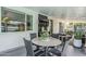 Outdoor dining area on a covered patio with view of the pool and backyard at 2109 W Berridge Ln, Phoenix, AZ 85015