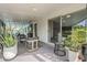 Covered patio with comfortable seating, plants, and view of the backyard at 2109 W Berridge Ln, Phoenix, AZ 85015