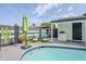 Inviting pool area with lounge chairs and umbrella for relaxing poolside at 2109 W Berridge Ln, Phoenix, AZ 85015
