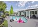 Sparkling pool with fun inflatables, surrounded by patio furniture, perfect for relaxation at 2109 W Berridge Ln, Phoenix, AZ 85015