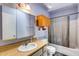 Bathroom with a vanity, sink, mirror, and a shower/tub combo with a curtain at 2129 N Summer St, Mesa, AZ 85203