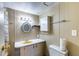 Bathroom featuring a bathtub with a curtain, and a countertop sink at 2129 N Summer St, Mesa, AZ 85203