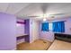 Purple bedroom featuring a window, ceiling fan, and open closet space at 2129 N Summer St, Mesa, AZ 85203