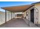 Covered carport leading to the front door with a gated entrance offers protection and convenience at 2129 N Summer St, Mesa, AZ 85203