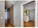 Hallway leading to the kitchen with light colored walls and vinyl flooring at 2129 N Summer St, Mesa, AZ 85203