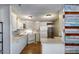 Kitchen with white cabinetry and appliances, and colorful wall decor at 2129 N Summer St, Mesa, AZ 85203