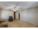 Comfortable living room with carpeted floors, ceiling fan, and ample space for relaxation and entertainment at 2129 N Summer St, Mesa, AZ 85203