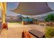 Spacious backyard with pergola, patio, and synthetic grass providing versatile outdoor living space at 2236 W Aston Dr, San Tan Valley, AZ 85144