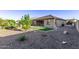 This well-designed backyard offers patio, manicured lawn, and desert landscaping, creating a peaceful retreat at 2236 W Aston Dr, San Tan Valley, AZ 85144