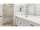 Clean bathroom featuring a white vanity, neutral walls, and bath/shower combination at 2236 W Aston Dr, San Tan Valley, AZ 85144