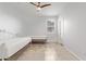 A cozy bedroom with tile flooring, neutral walls, and ceiling fan at 2236 W Aston Dr, San Tan Valley, AZ 85144