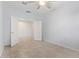 Bedroom featuring tile flooring, neutral walls, open closet area, and ceiling fan at 2236 W Aston Dr, San Tan Valley, AZ 85144