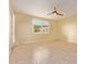 Bright bedroom featuring a ceiling fan, window, neutral paint and tile floor at 2236 W Aston Dr, San Tan Valley, AZ 85144