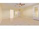 Spacious primary bedroom offers tile floors, neutral paint, and a private exterior entry at 2236 W Aston Dr, San Tan Valley, AZ 85144