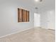 Bedroom with tile floors, ceiling fan, wooden art, and a connecting doorway to the home at 2236 W Aston Dr, San Tan Valley, AZ 85144