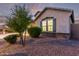 A well maintained single story home with blue shutters and a manicured lawn at 2236 W Aston Dr, San Tan Valley, AZ 85144