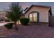 A well maintained single story home with blue shutters and a manicured lawn at 2236 W Aston Dr, San Tan Valley, AZ 85144
