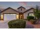 Charming single-story home featuring a well-manicured yard, a two-car garage, and inviting front entrance at 2236 W Aston Dr, San Tan Valley, AZ 85144