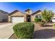 Charming single-story home featuring a well-manicured yard, a two-car garage, and inviting front entrance at 2236 W Aston Dr, San Tan Valley, AZ 85144